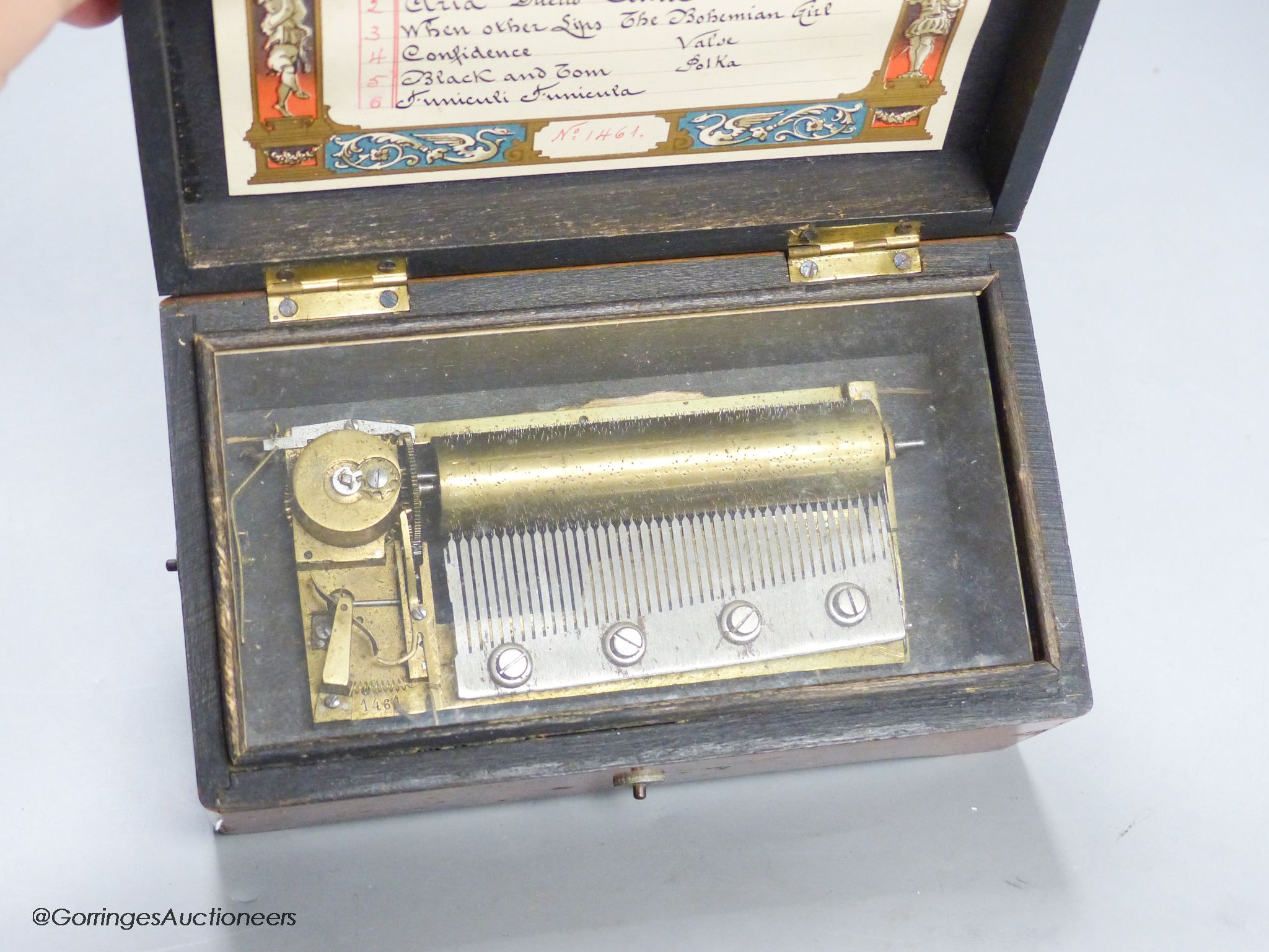 A small Swiss amboyna six air cylinder musical box